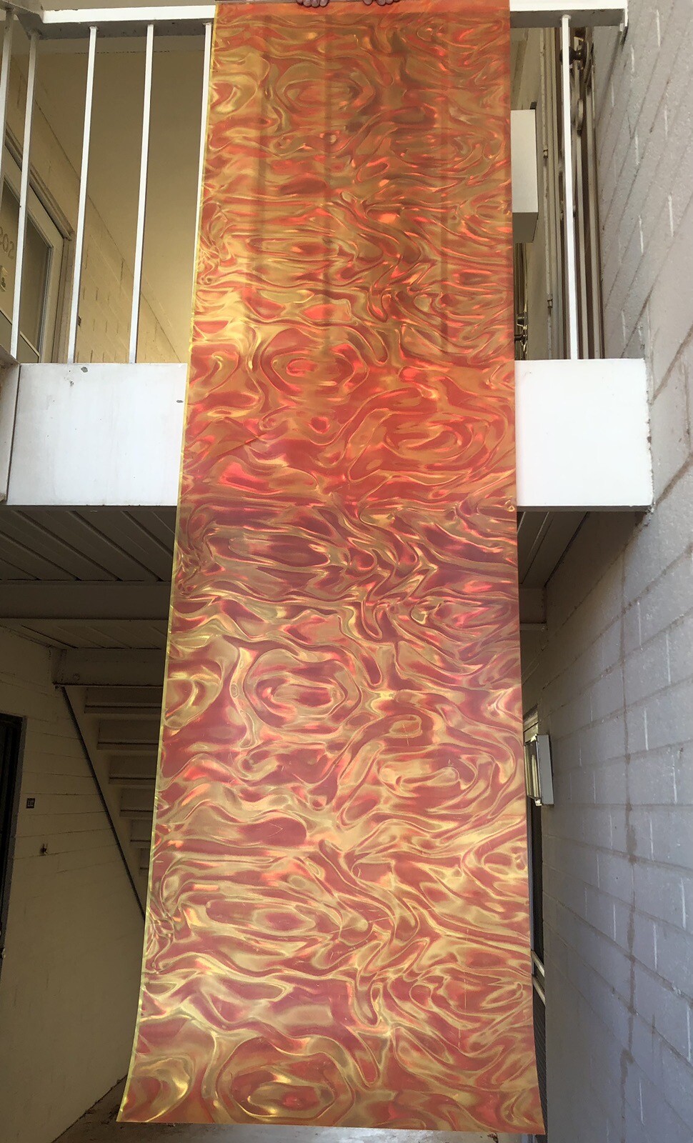 Orange Backdrop screen 25” x 88”, ribbon prismatic, metal/plastic hanging frame