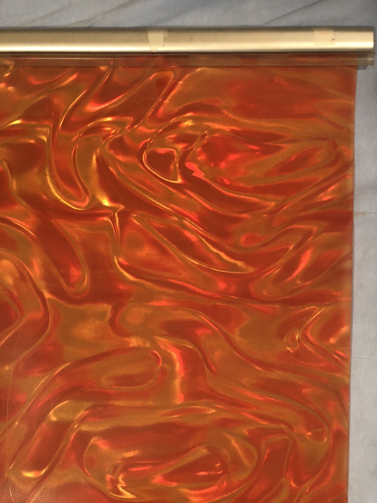 Orange Backdrop screen 25” x 88”, ribbon prismatic, metal/plastic hanging frame